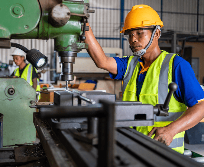 Profit Isle for Manufacturing: Man working at equipment in manufacturing plant